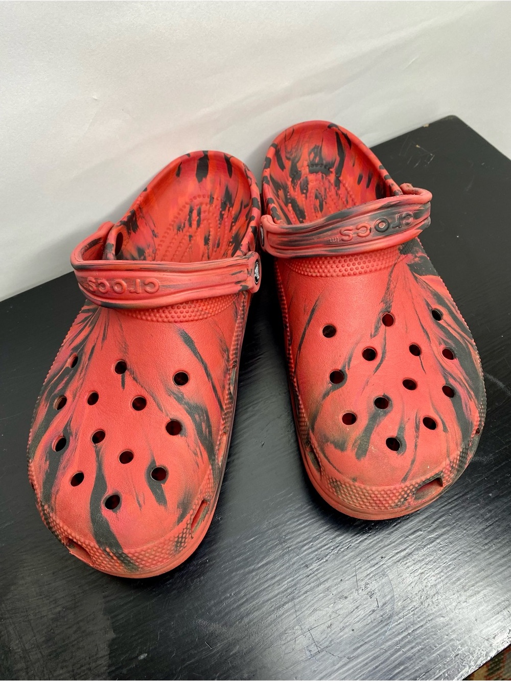 Red and black animal stripe crocs